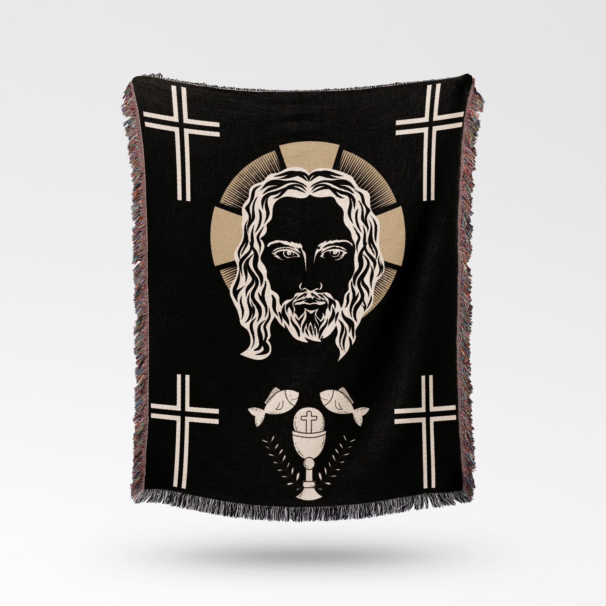 Black throw blanket featuring Jesus' face, crosses, fish, and a chalice.