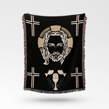 Black throw blanket featuring Jesus' face, crosses, fish, and a chalice.