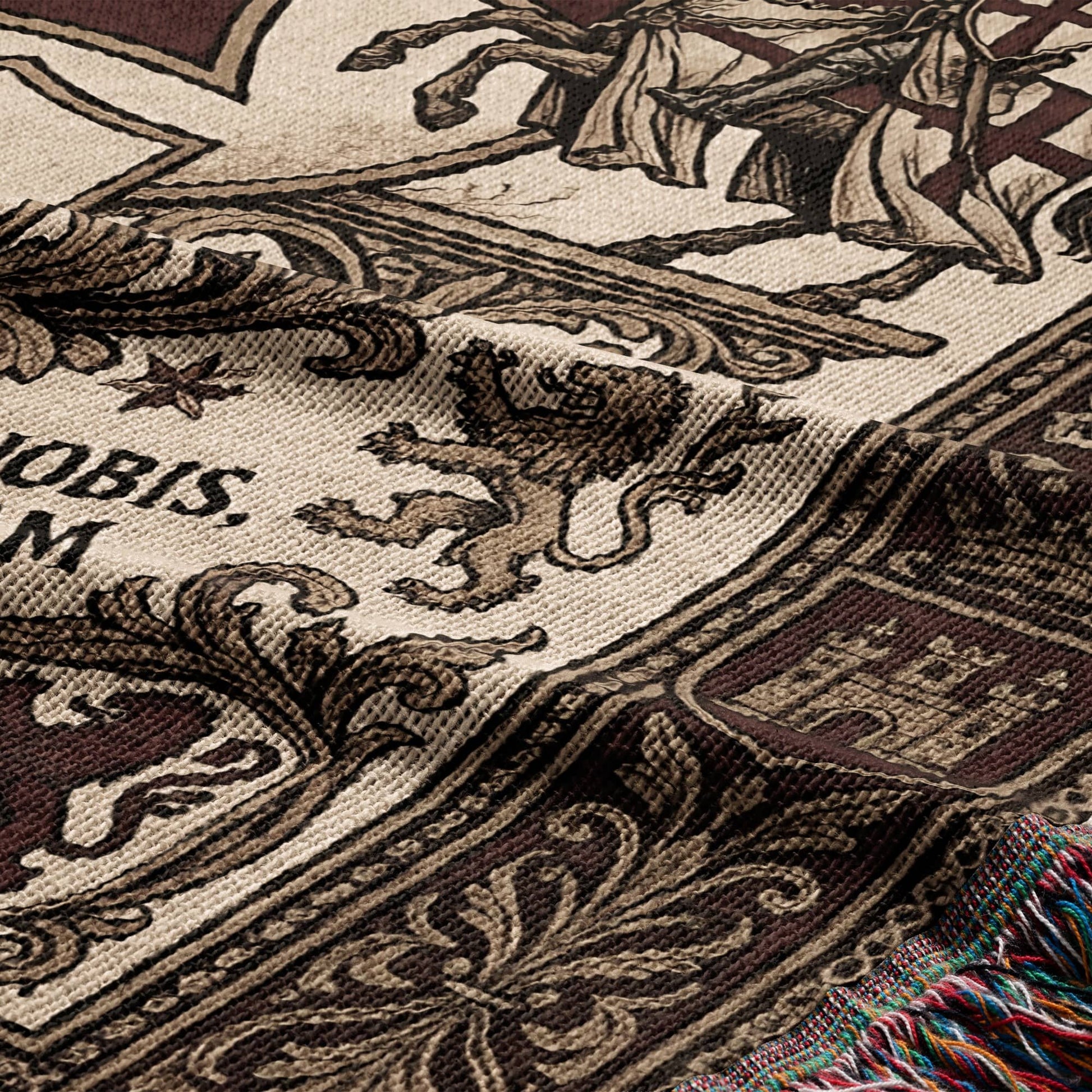 Woven tapestry detail with lion, knight, and castle motifs, includes text "NOBIS. M"