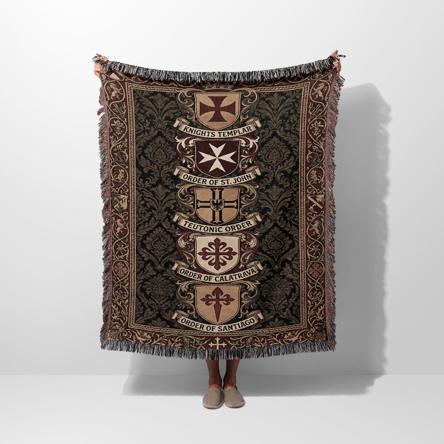 Woven blanket with heraldic crests and text: Knights Templar, Order of St. John, Teutonic Order, Order of Calatrava, Order of Santiago.