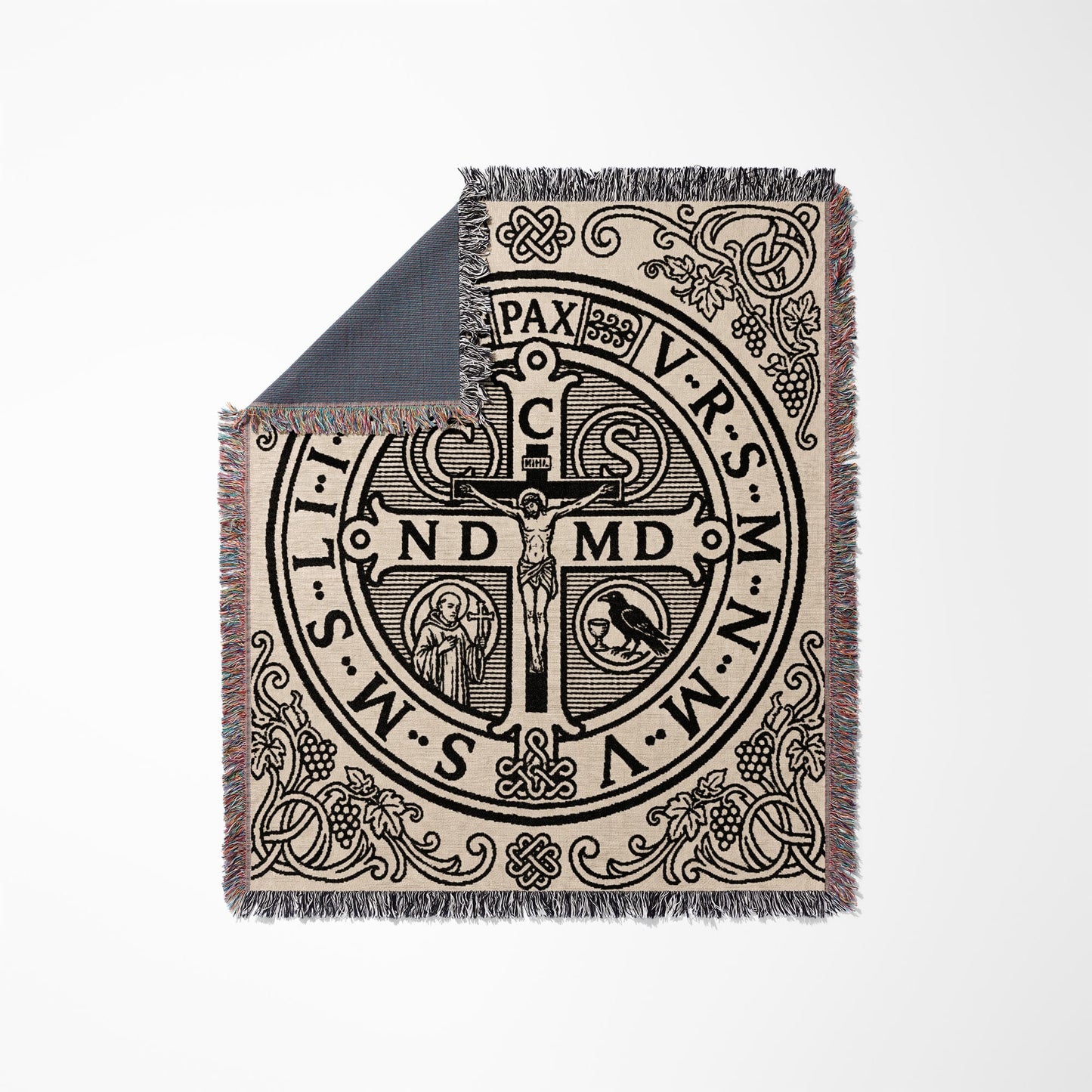 Woven throw blanket with St. Benedict medal design and tasseled edges.