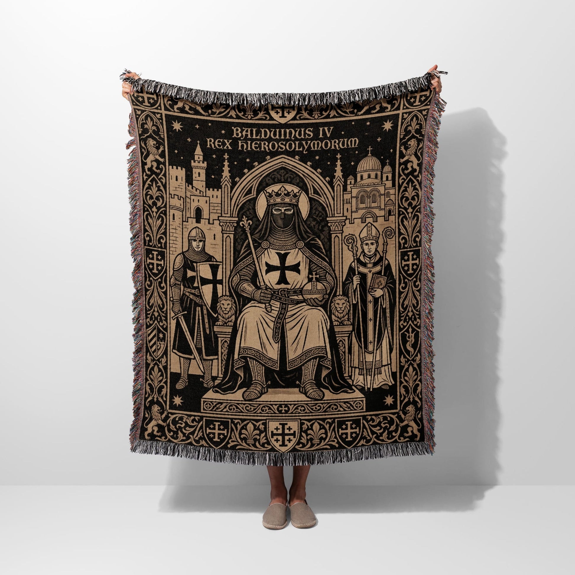 Tapestry with black and tan medieval illustration of a king on a throne with knights and a bishop.