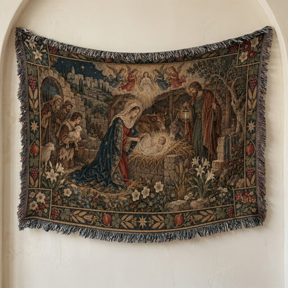 Woven tapestry depicting the Nativity scene with Mary, Joseph, baby Jesus, and animals, with fringed edges.