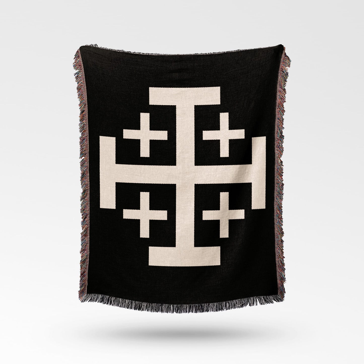 Black woven throw blanket with a large cream Jerusalem cross pattern.