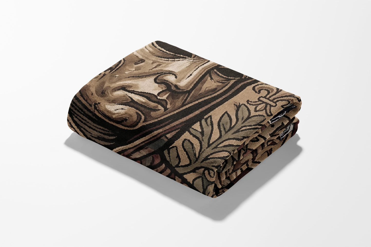 Folded blanket with intricate brown and tan abstract floral pattern.