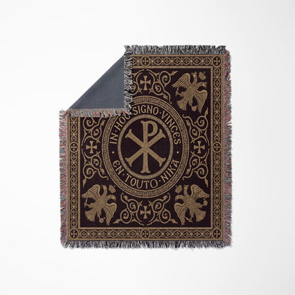 Brown tapestry with gold Byzantine eagle and Chi Rho cross symbols.