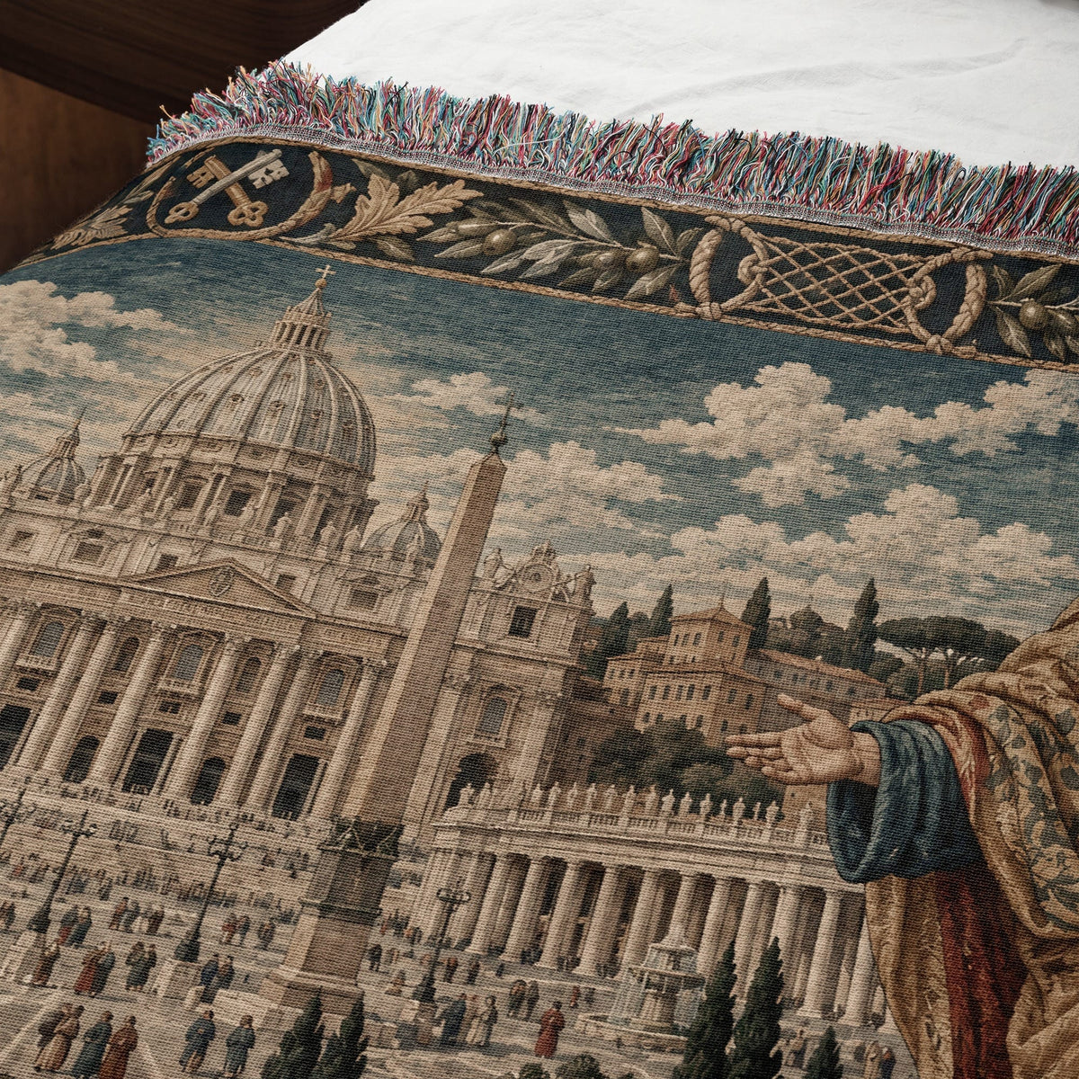 A woven throw blanket depicting Saint Peter's Basilica with a decorative border and fringed edge.