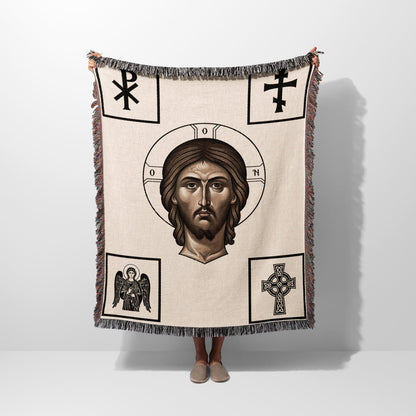 Woven throw depicting a portrait of Jesus surrounded by Christian symbols.