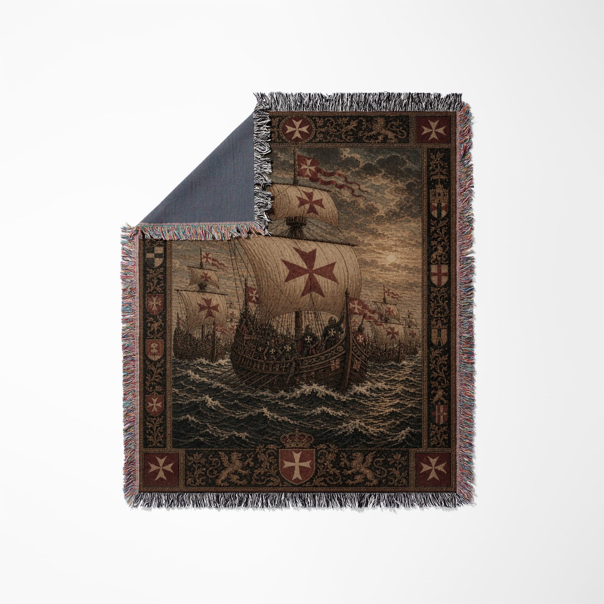 Woven blanket depicting a fleet of galleons with red crosses, framed by ornate patterns.