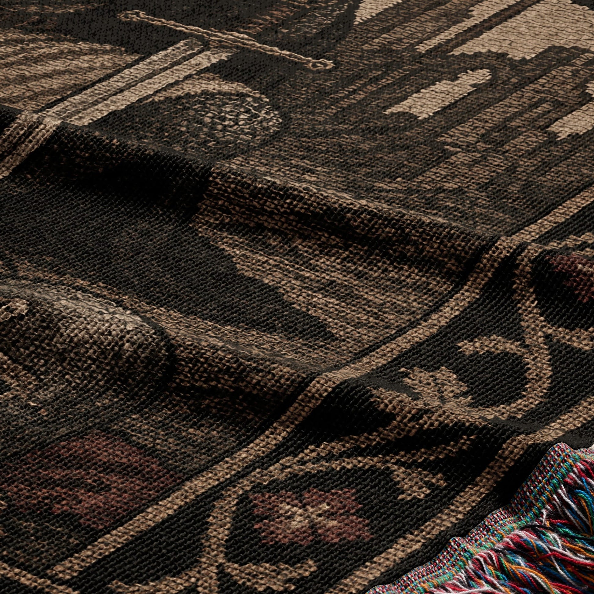 Woven blanket with intricate pattern in brown, black, and red.