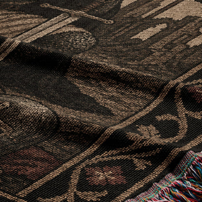 Woven blanket with intricate pattern in brown, black, and red.
