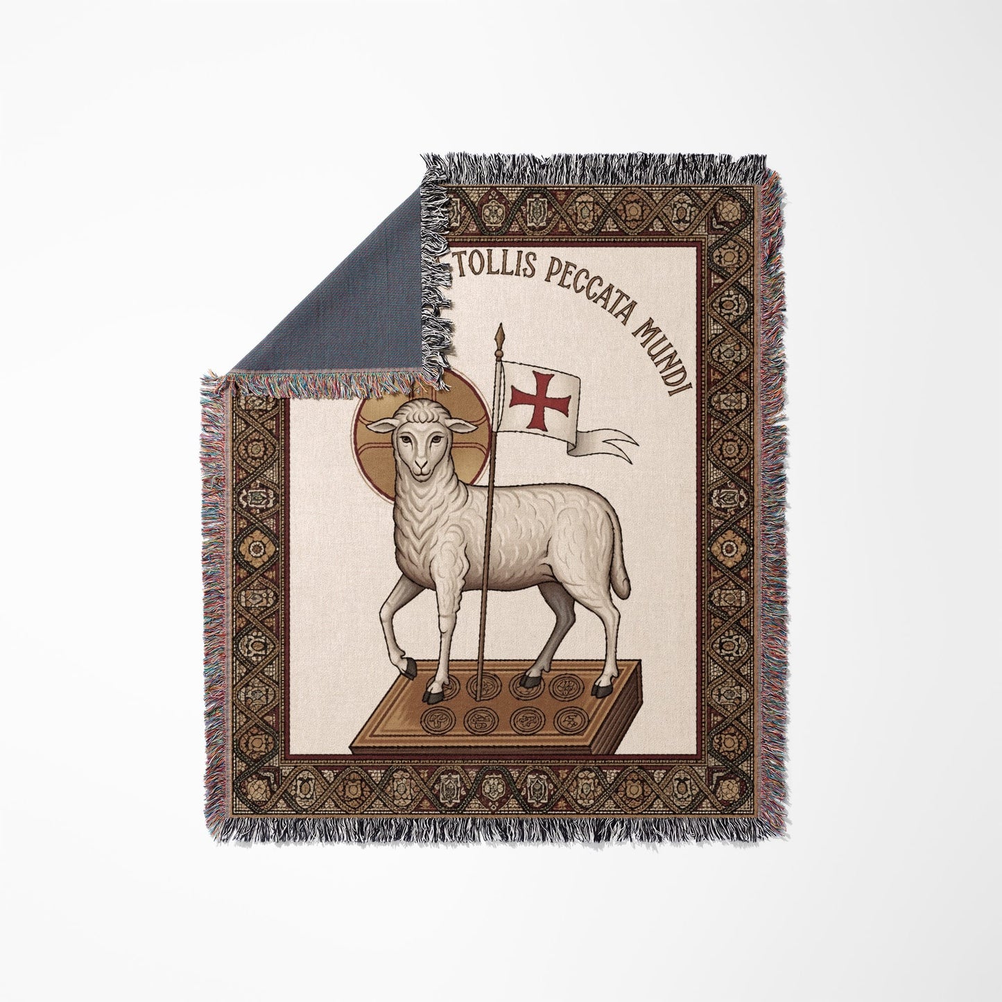 Agnus Dei with Latin text "Tollis Peccata Mundi" on a woven blanket.