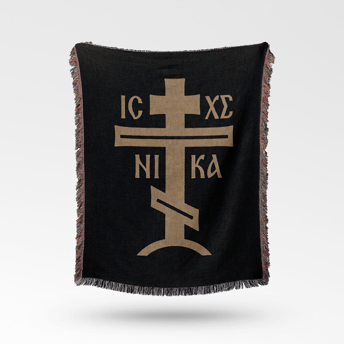 Black woven throw blanket with a gold Orthodox Christian cross and IC XC NI KA inscription.