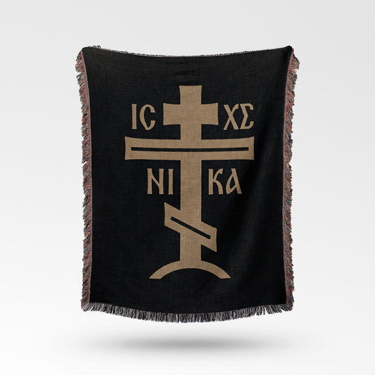 Black woven throw blanket with a gold Orthodox Christian cross and IC XC NI KA inscription.