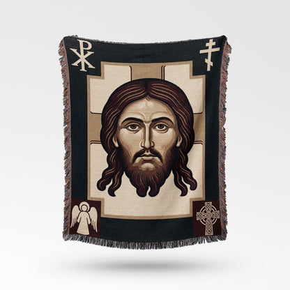 Tapestry featuring a portrait of Jesus Christ with ornate borders and Christian symbols.