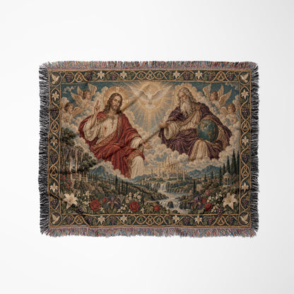 A woven blanket featuring a religious scene with Jesus, God, a dove, angels, and a landscape.