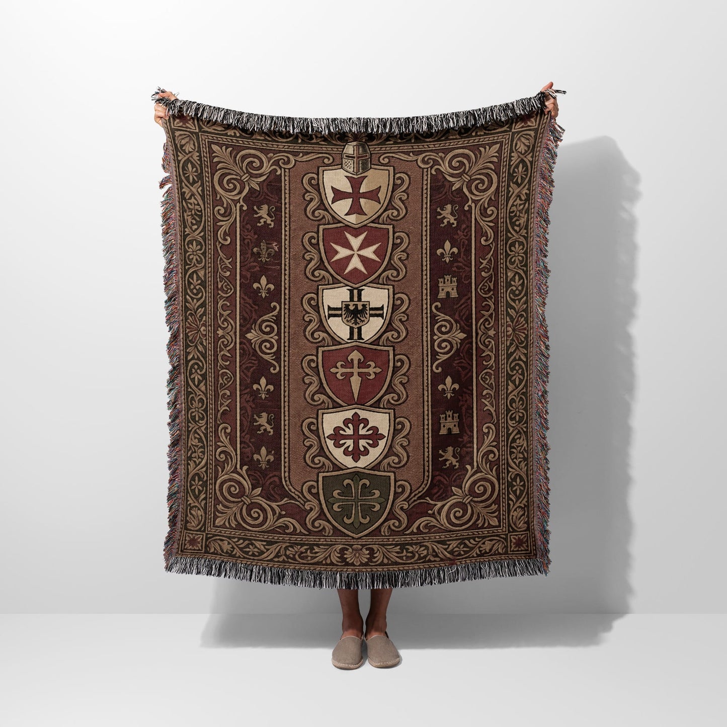 Woven tapestry throw with knightly shields and ornate borders.