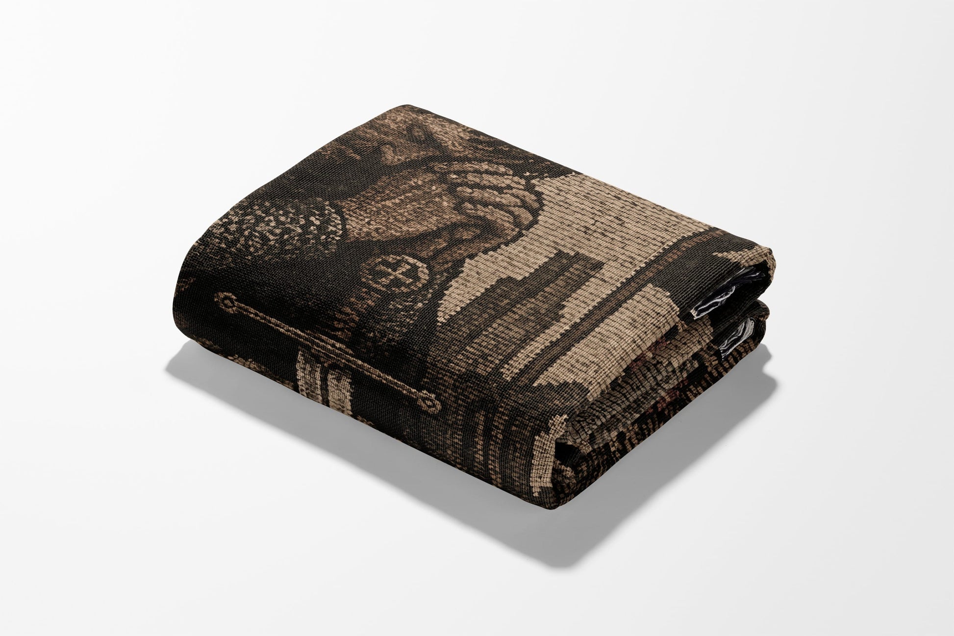 Folded blanket with detailed pattern of a knight and cityscape.