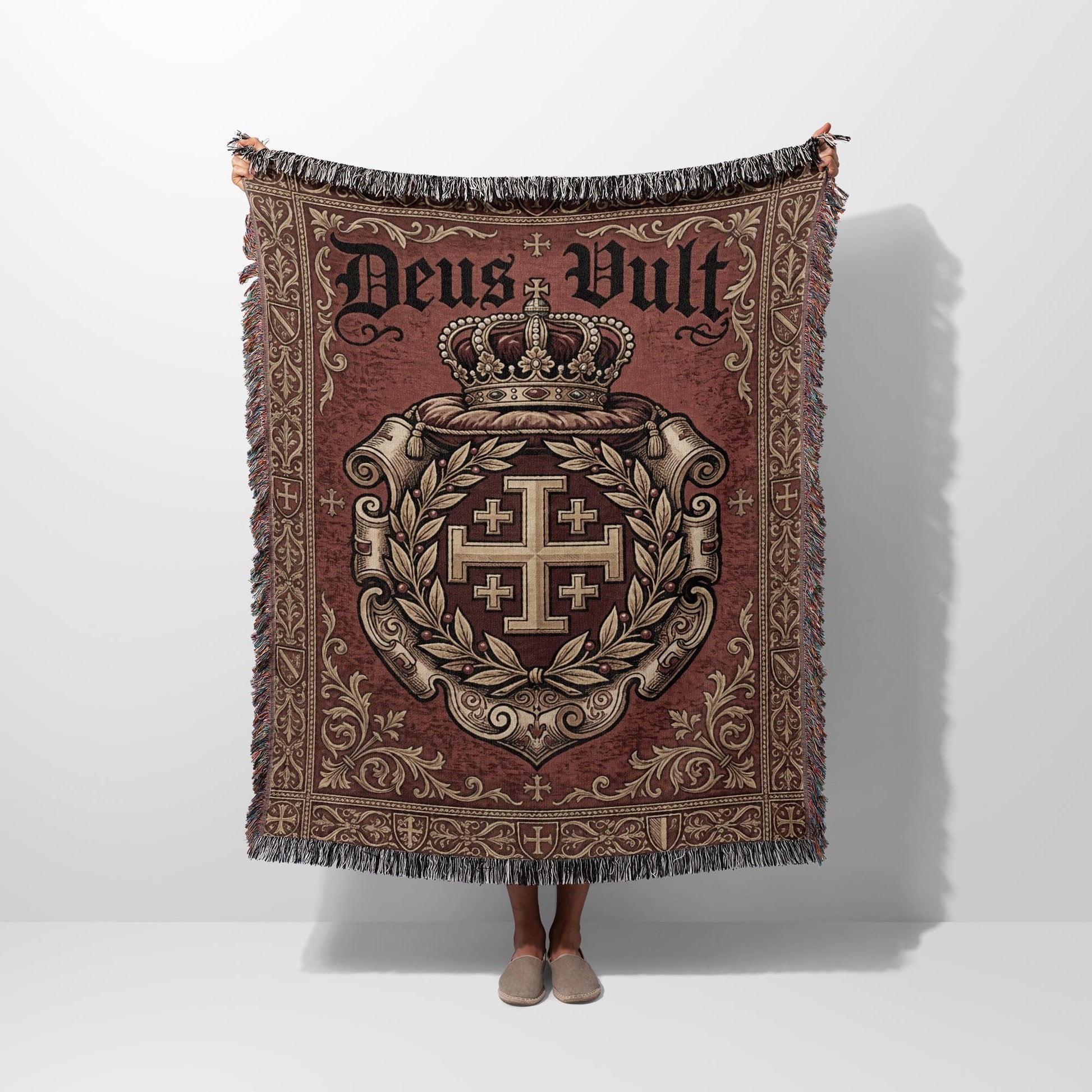 Woven tapestry throw with a crown, Jerusalem cross, and "Deus Vult" text.