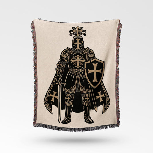 Knight in armor with sword and shield on a woven blanket.