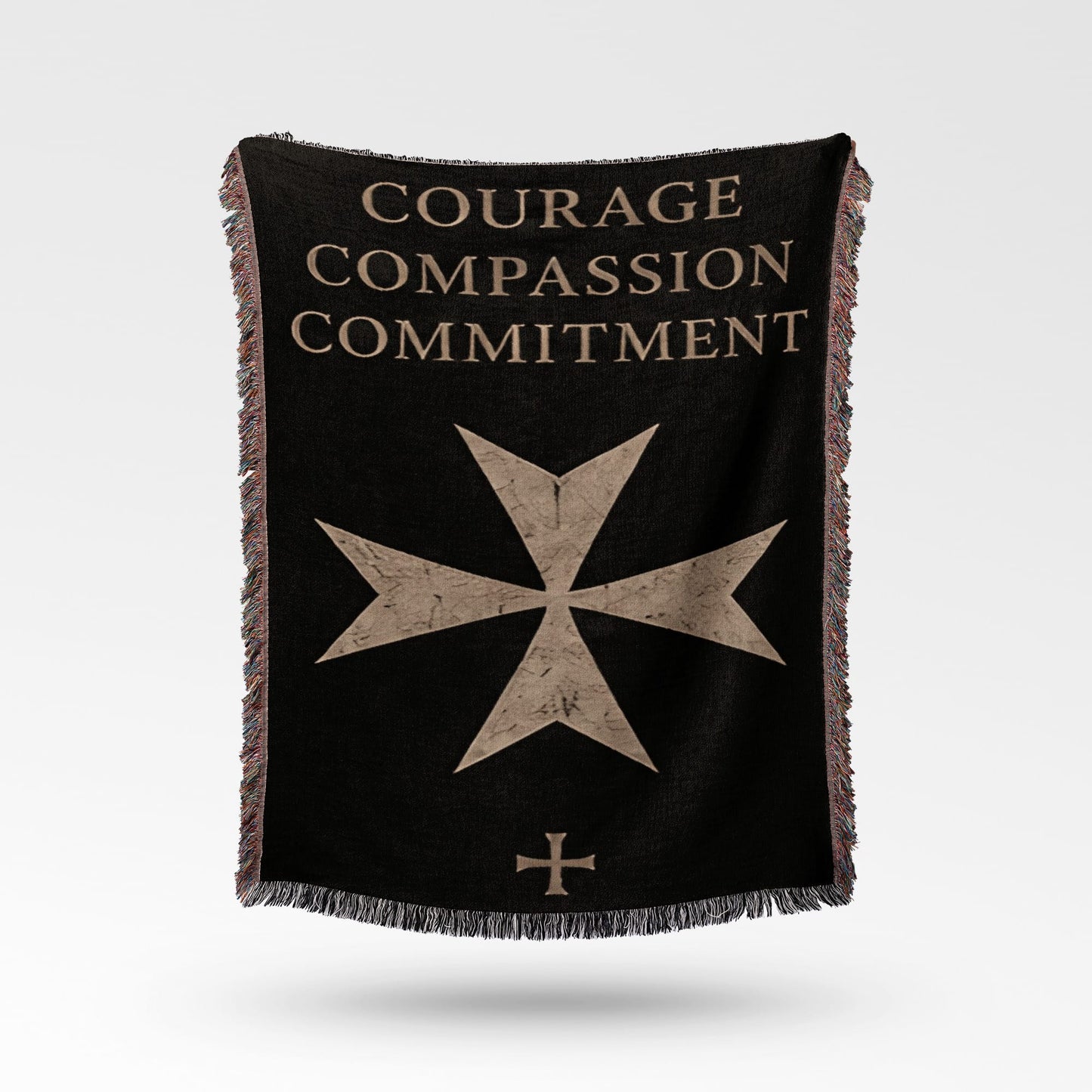 Black blanket with "Courage Compassion Commitment" and Maltese cross emblem.