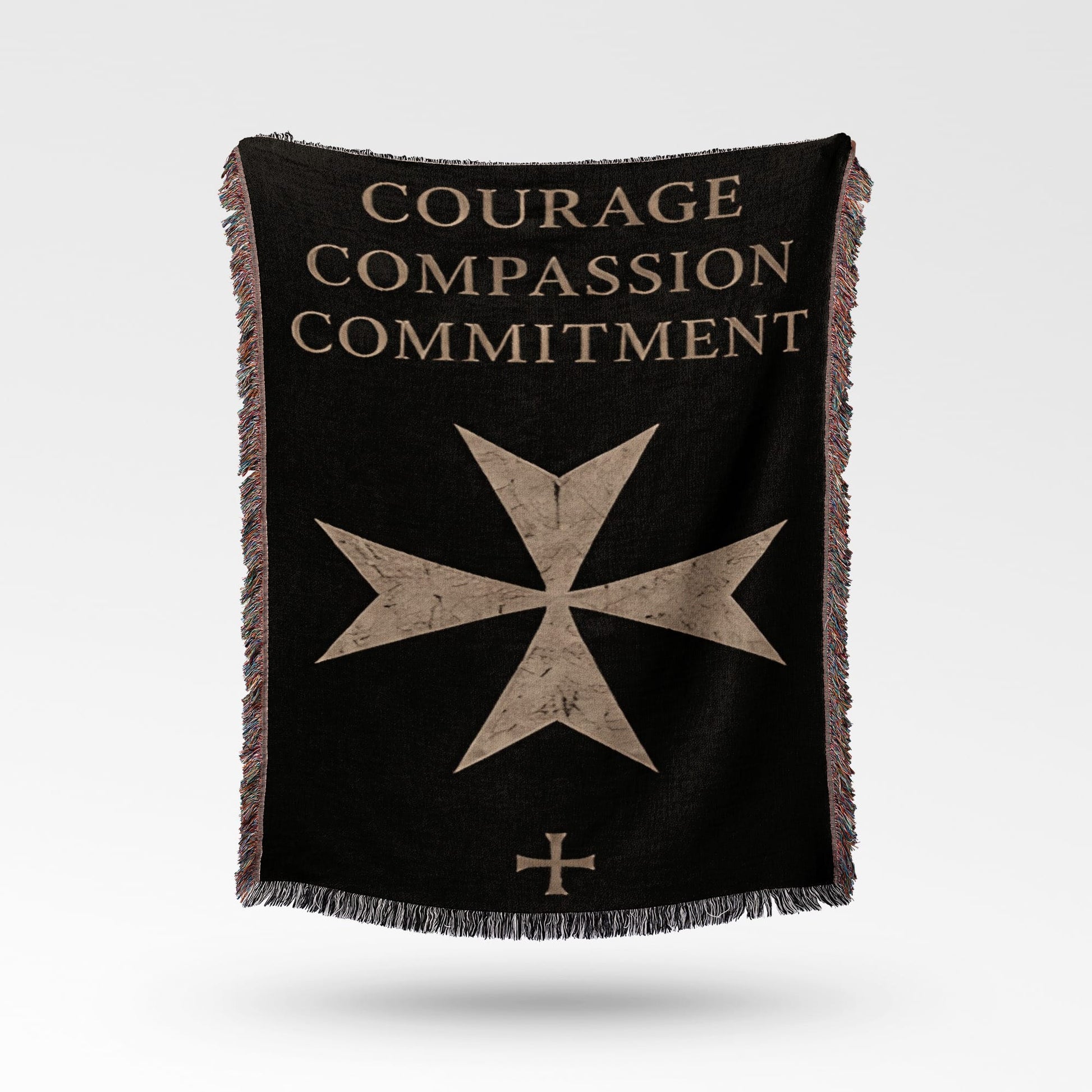 Black blanket with "Courage Compassion Commitment" and Maltese cross emblem.