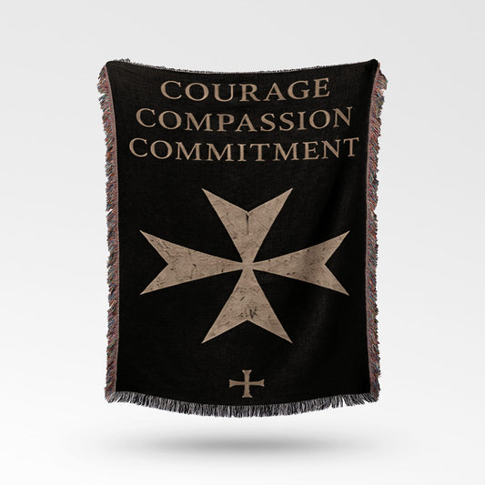 Black blanket with "Courage Compassion Commitment" and Maltese cross emblem.