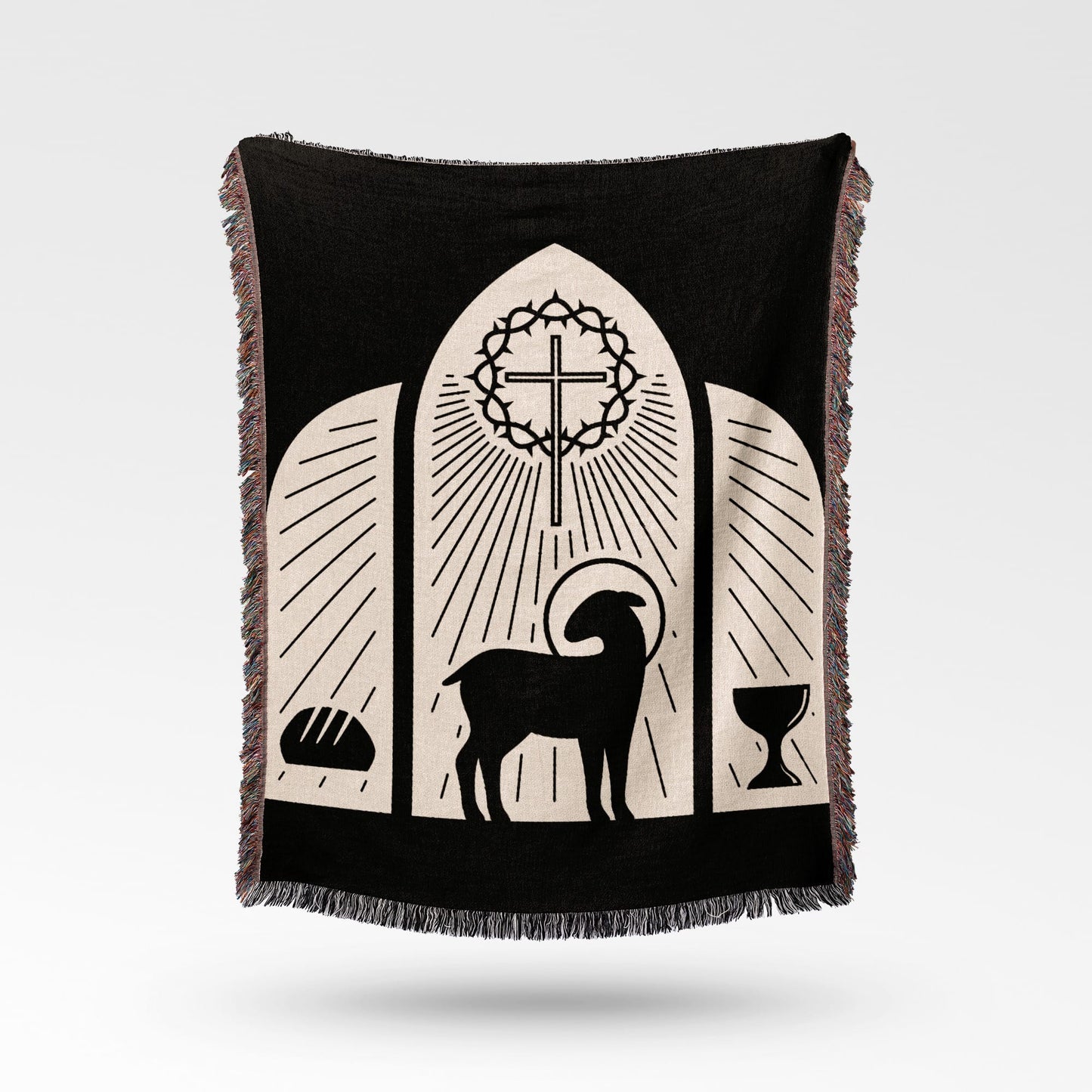 Black blanket with a lamb, cross, bread, and chalice design.