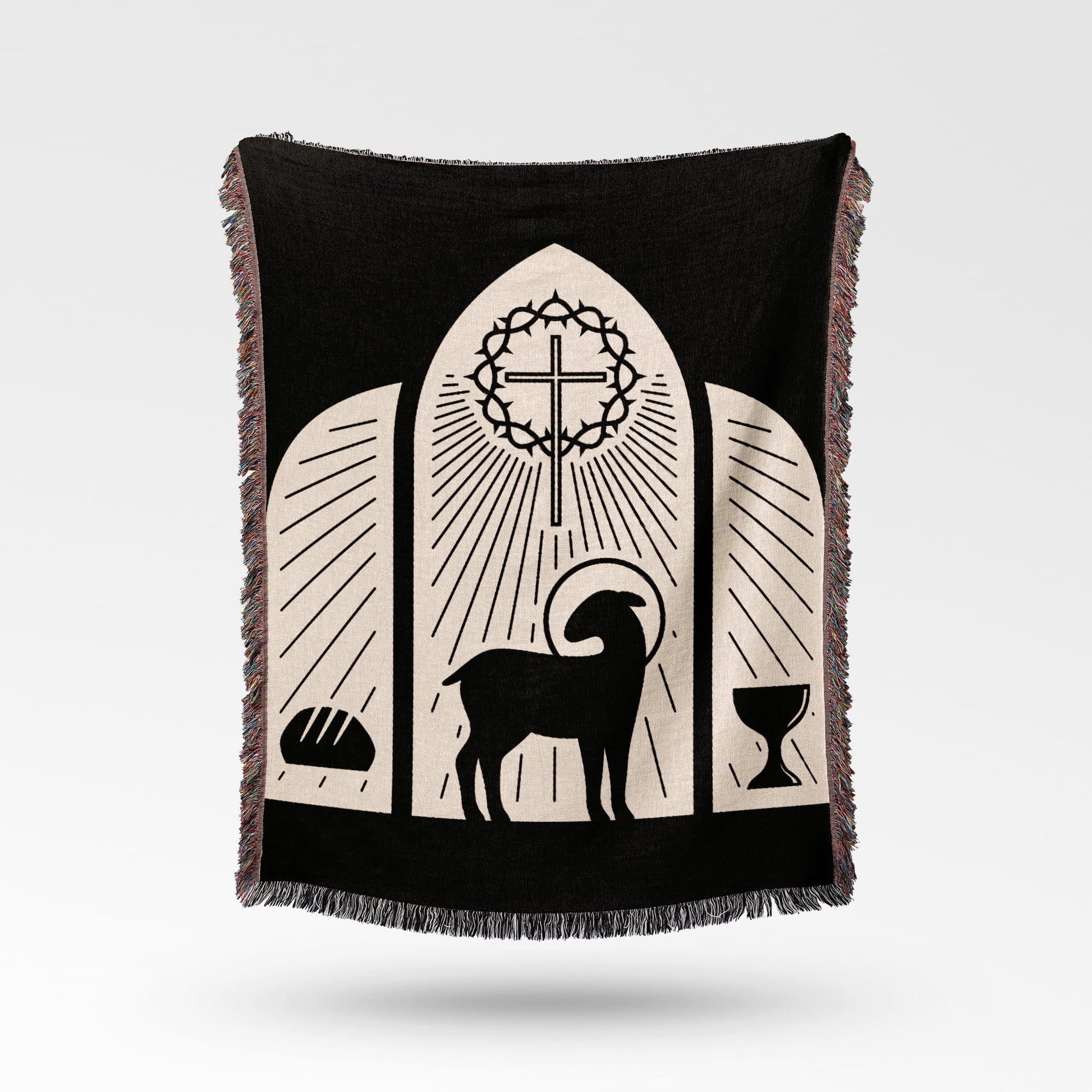 Black blanket with a lamb, cross, bread, and chalice design.