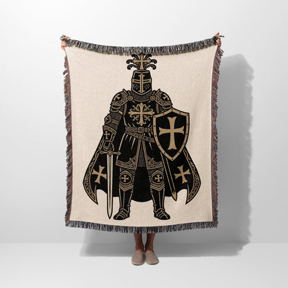 Tapestry blanket with knight in full armor holding sword and shield.