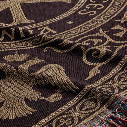 Brown woven blanket with gold eagle and ornate scrollwork detail.