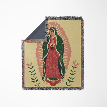 Woven blanket featuring Our Lady of Guadalupe with floral accents.