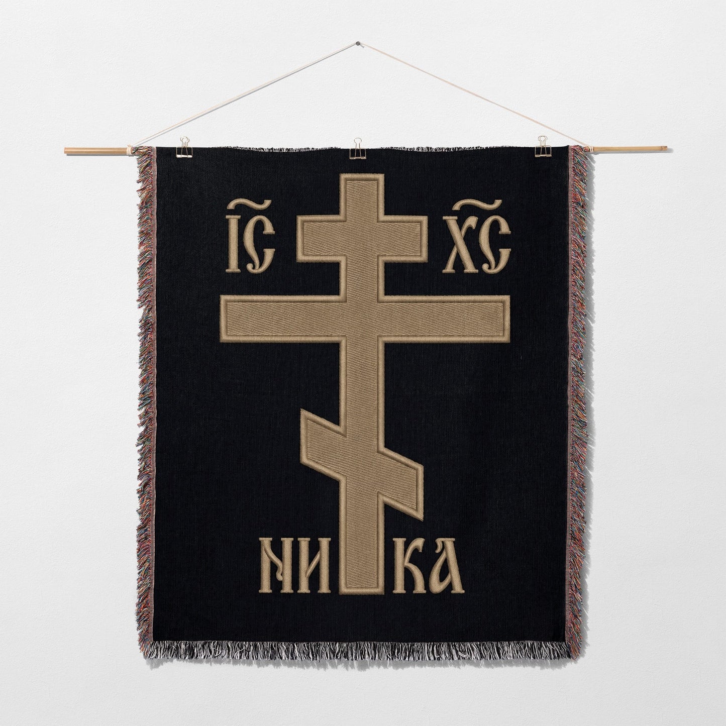 Orthodox Christian cross with "INRI" and "IC XC" text on black fabric.