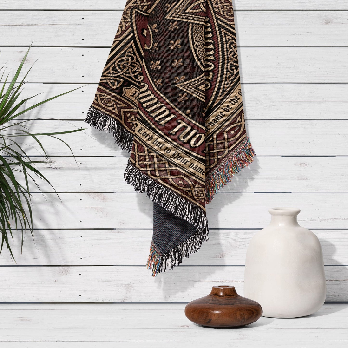 Tapestry with Celtic knot design and "Glory to God" text hangs on a white wooden wall.