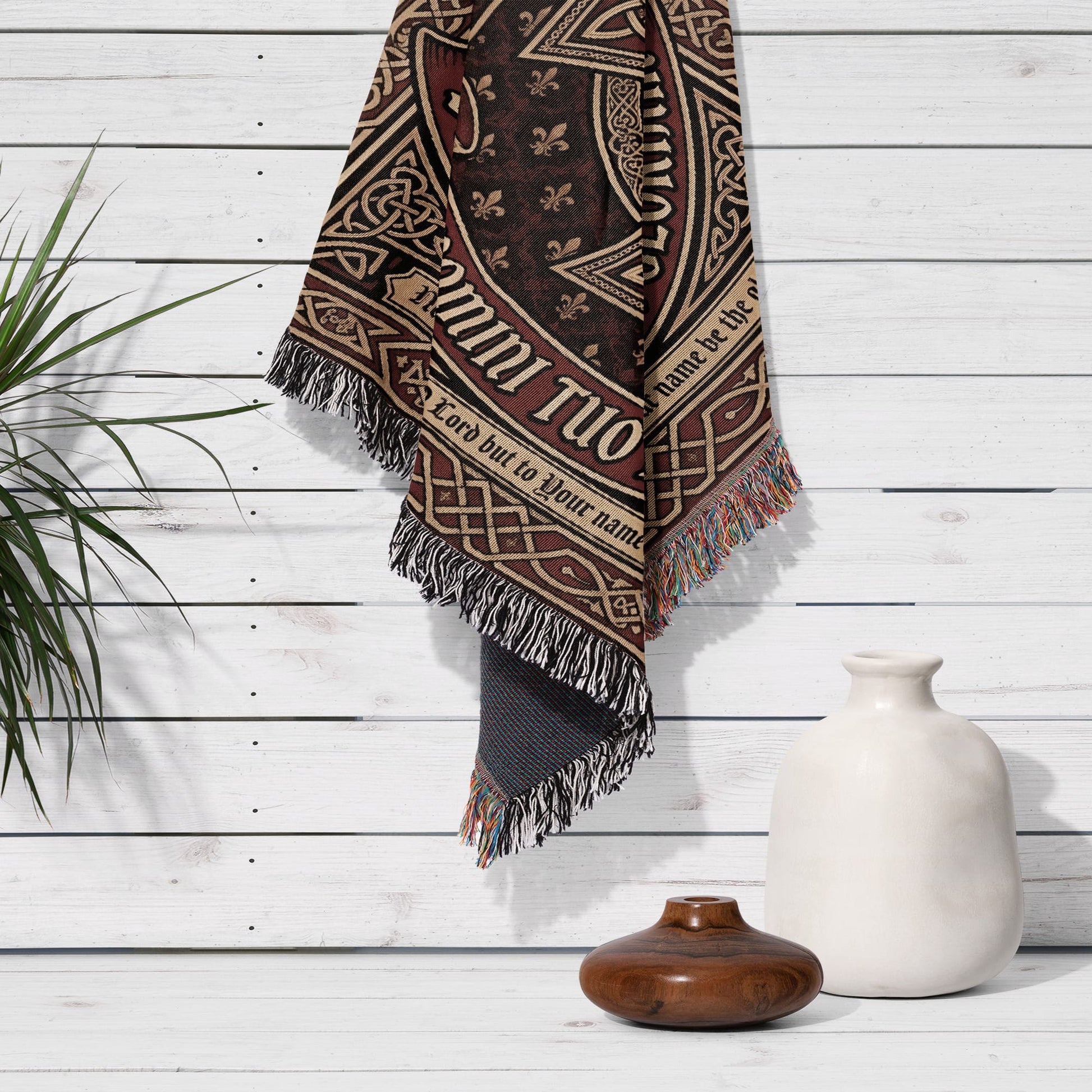 Tapestry with Celtic knot design and "Glory to God" text hangs on a white wooden wall.