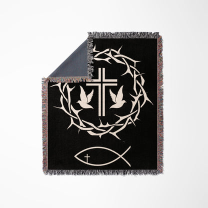Black throw blanket with white crown of thorns, two doves, and a fish symbol.
