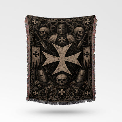 Templar cross with helmets, swords, and skulls on a dark woven blanket.