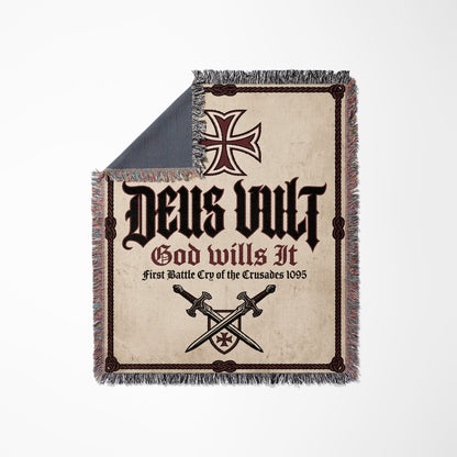 Woven blanket with "Deus Vult" and swords.