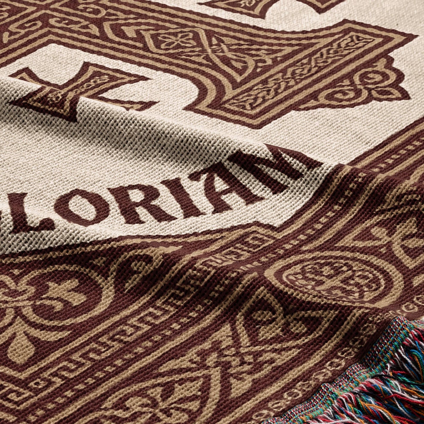 Brown blanket with "GLORIAN" text and decorative border pattern.