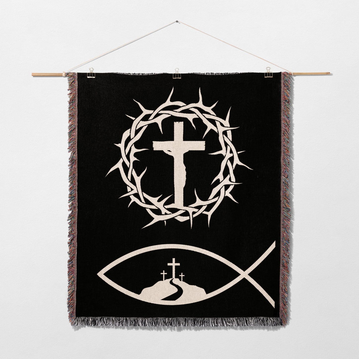 Black tapestry with white crown of thorns, crucifix, and fish symbol.