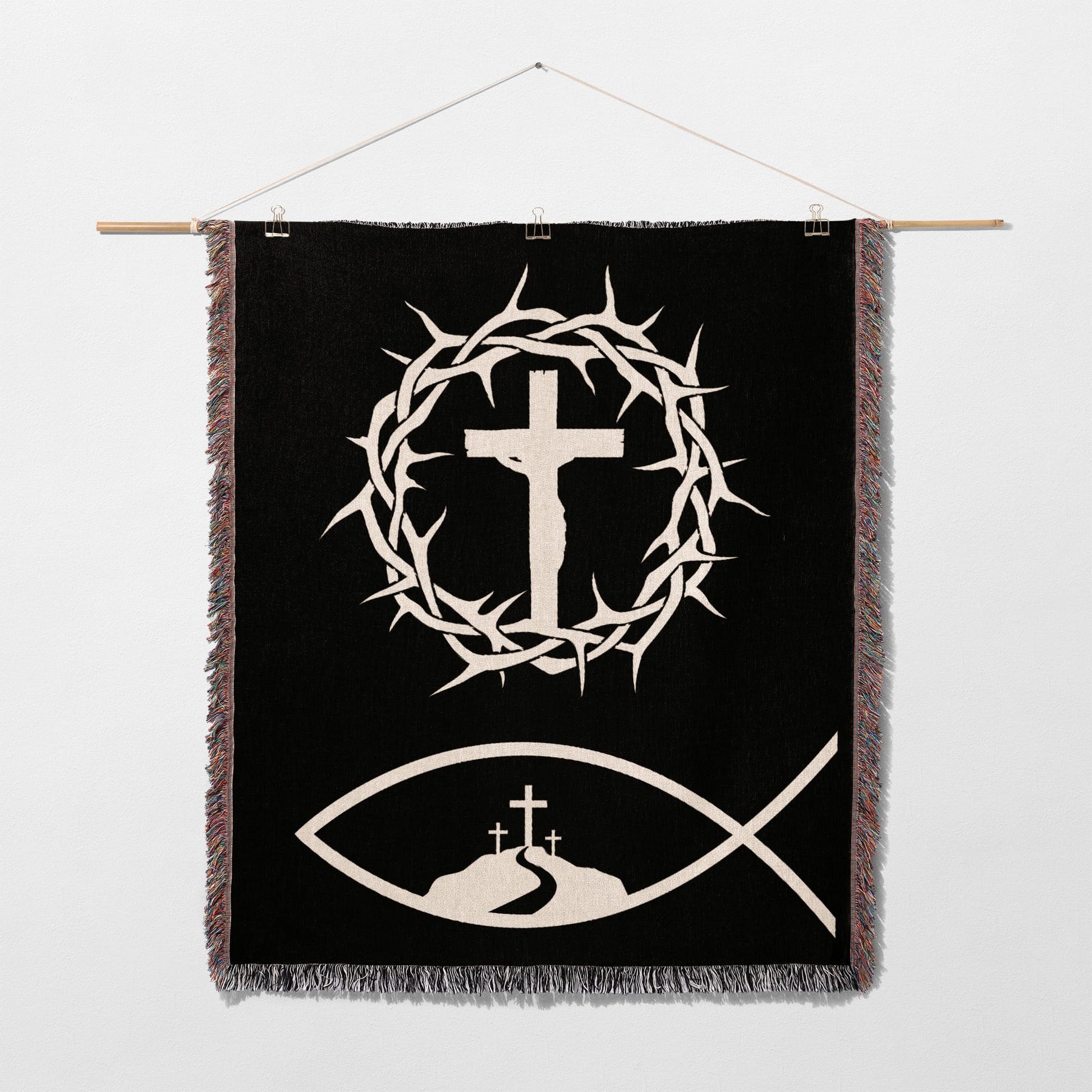 Black tapestry with white crown of thorns, crucifix, and fish symbol.