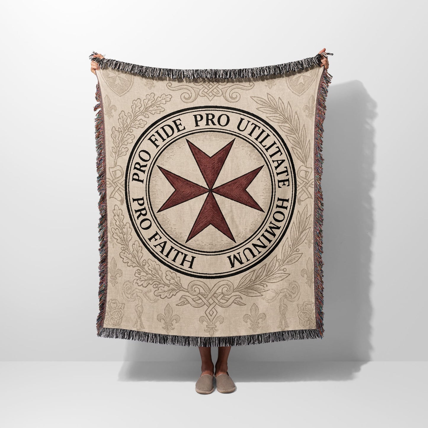 Beige blanket featuring a red Maltese cross and Latin text.