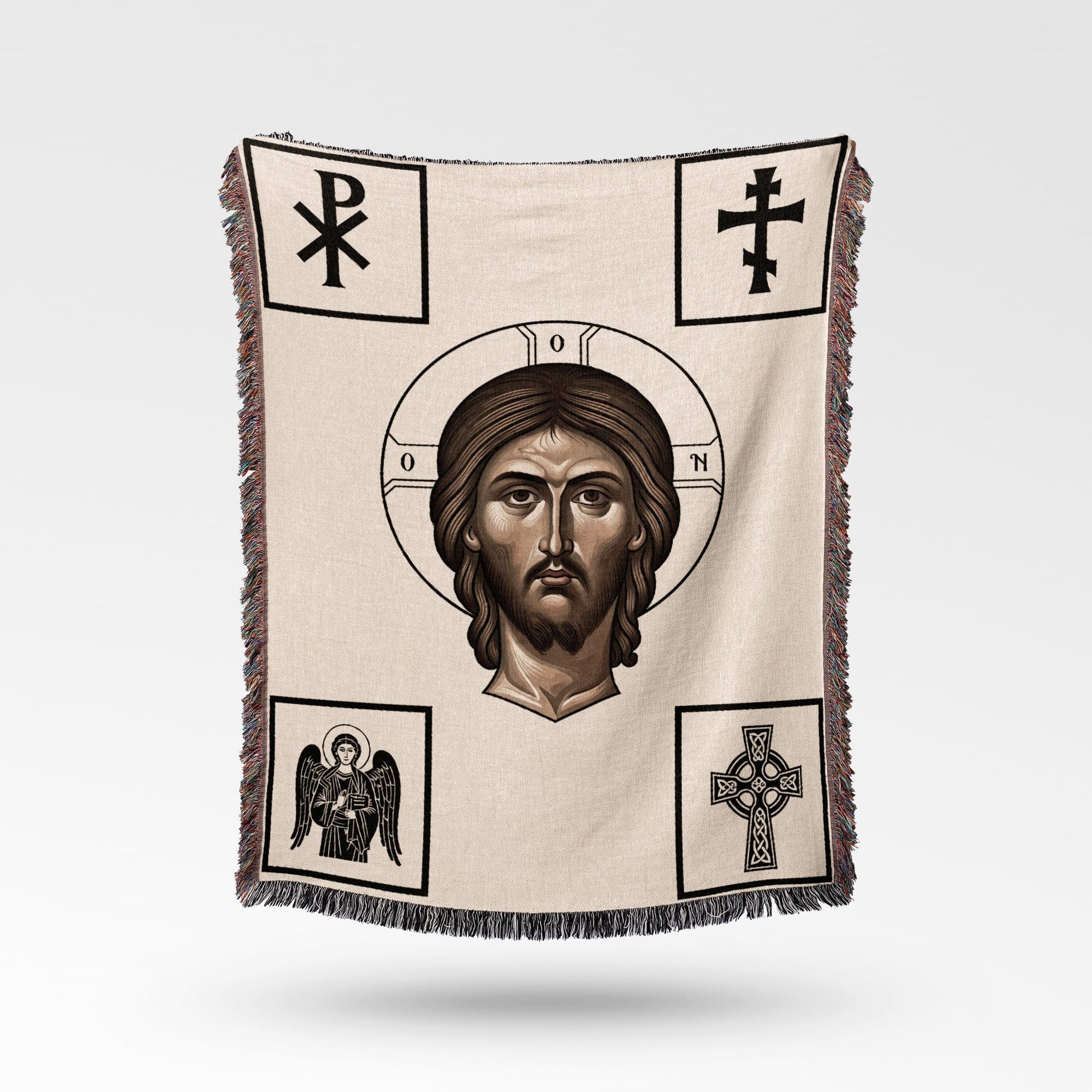 Woven blanket featuring Jesus Christ's face and religious symbols.