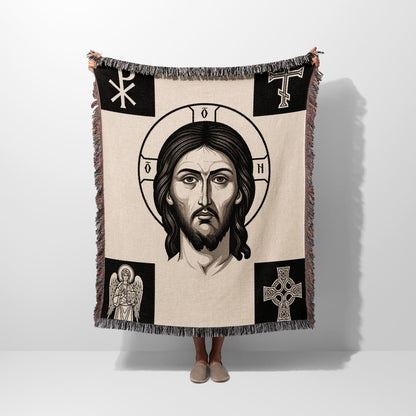 Tapestry blanket with Jesus' face, cross, angel, and Celtic cross motifs.