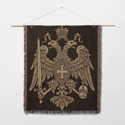 Embroidered tapestry of a double-headed eagle holding sword and orb.