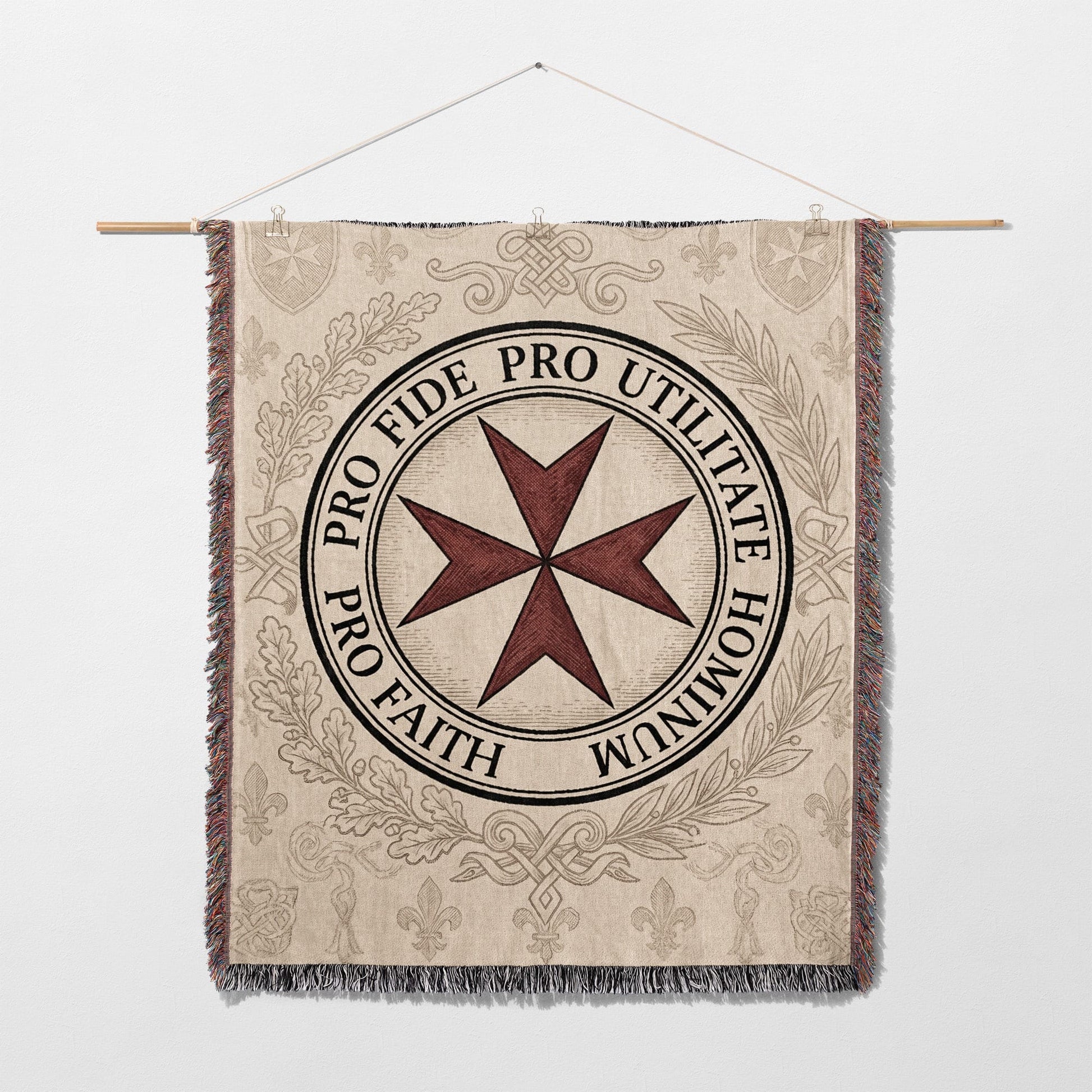Tapestry featuring a red Maltese cross and Latin text PRO FIDE PRO UTILITATE HOMINUM.
