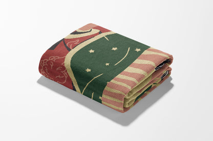 Folded blanket with a celestial pattern featuring stars and stripes.