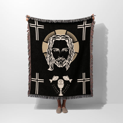 Black throw blanket featuring Jesus' face, crosses, and a chalice with fish.