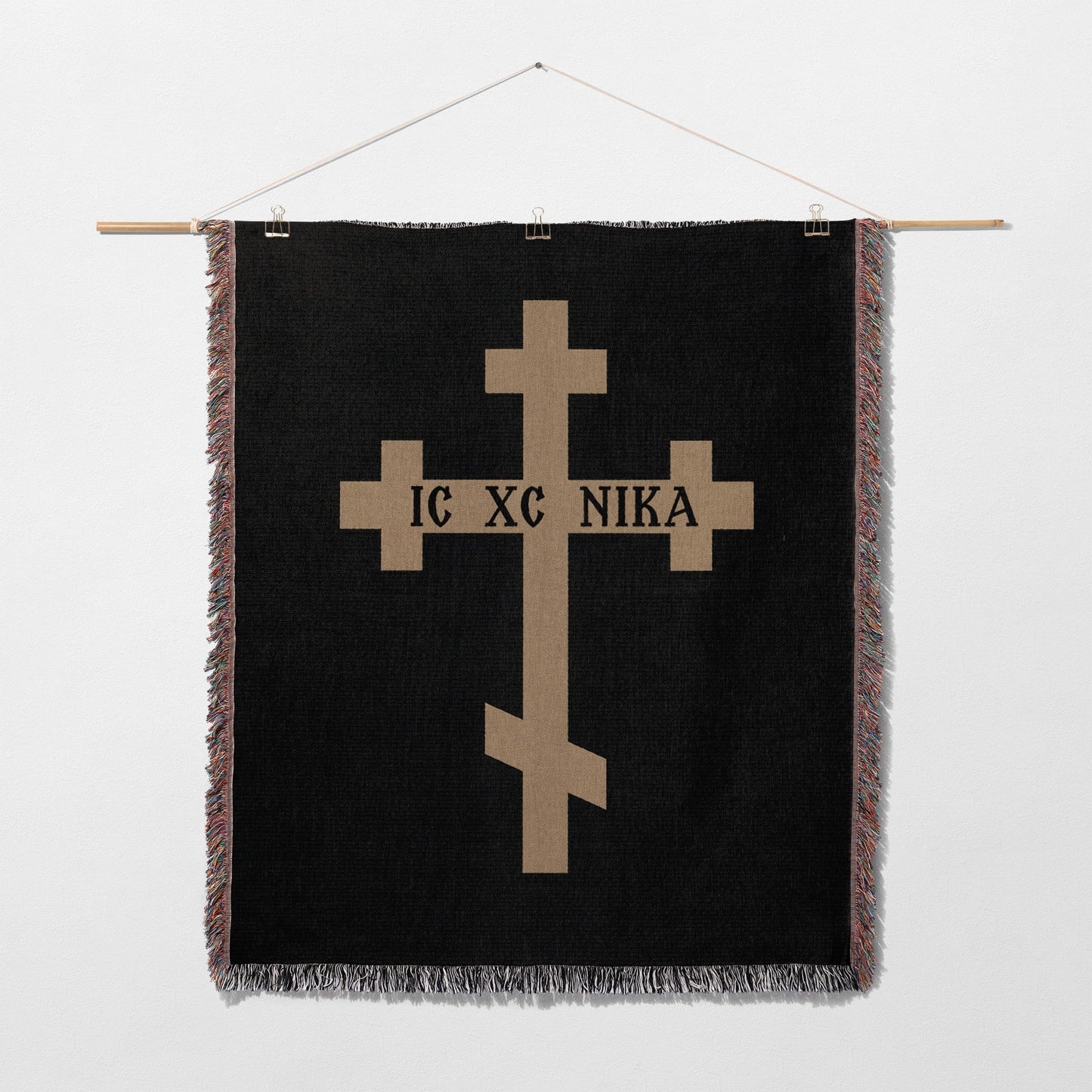 Black tapestry with gold Orthodox cross and text IC XC NIKA.