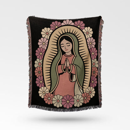 Blanket featuring an illustration of the Virgin Mary surrounded by flowers.